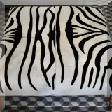 F02. Zebra cocktail ottoman. 19”h x 42”w x 42”d 